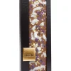 Fashion chocome milk chocolate with crystallized violet petals coconut shavings and with genuine 23 karat gold crumbs